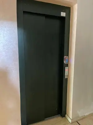 a dark green door in a room at Private, Air Conditionner and Free Parking in Fès
