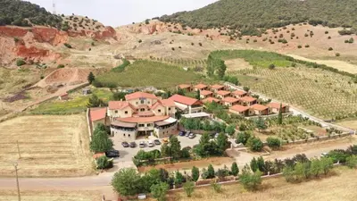 an aerial view of a house in a mountain at Chalets-Appartements Tourtite in Ifrane