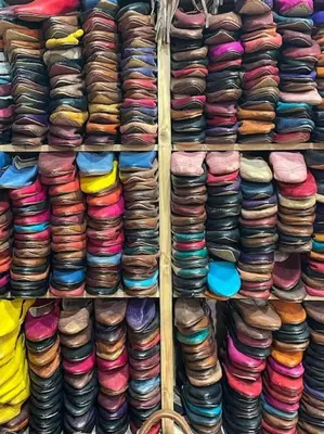 a shelf filled with lots of different types of hats at Appartement Centre Ville - ATLAS 46 in Fès