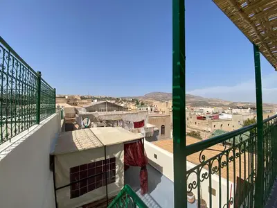 a balcony with a view of a city at Dar Zarbtana Chambre Marrakech in Fès
