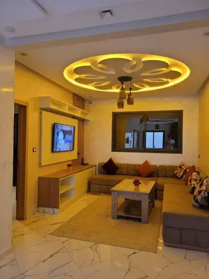 a living room with a couch and a table at Bella nova in Azrou