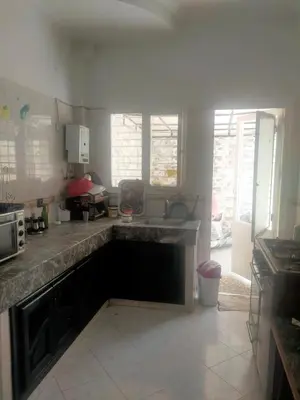 a kitchen with a sink and a counter top at Maison in Ville Nouvelle