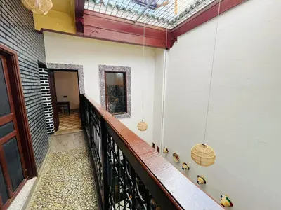 a hallway of a house with a balcony at Dar Boujloud Fez in Fès