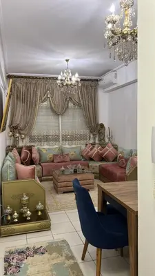 a living room with a couch and a table at واد فاس in Fès