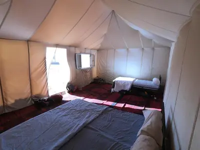 a room with a tent with a bed in it at Sahara Dream Camp in Oulad Hammou