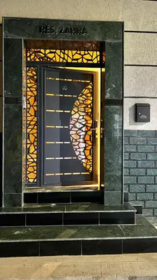 a door with a stained glass window on a building at Oasis deluxe in Fès