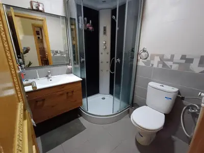 a bathroom with a shower and a toilet and a sink at Dar serenity in Meknès
