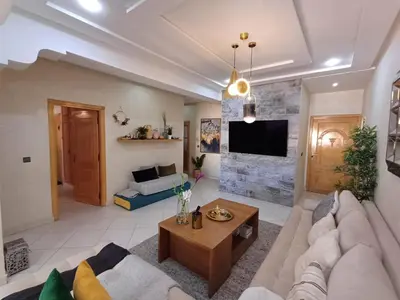 a living room with a couch and a table at Dar serenity in Meknès