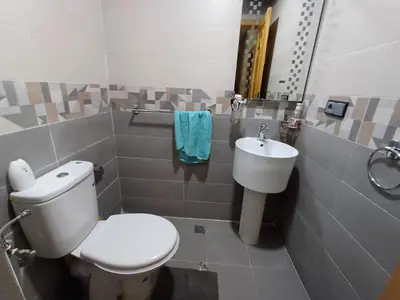 a bathroom with a toilet and a sink at Dar serenity in Meknès