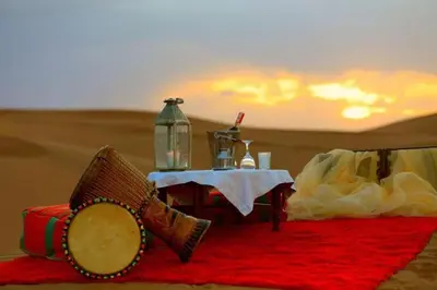 a table in the middle of the desert at Diamond luxury camp in Merzouga