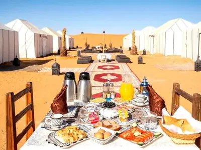 a table with food on it in the desert at Diamond luxury camp in Merzouga