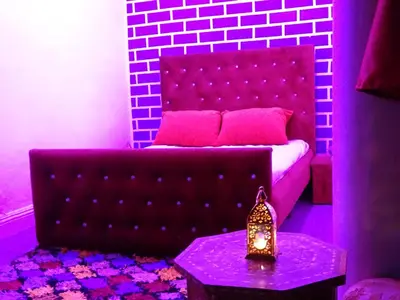 a living room with a couch and a table at el habib in Fès