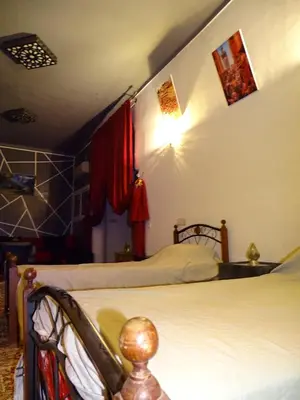a bedroom with two beds in a room at el habib in Fès