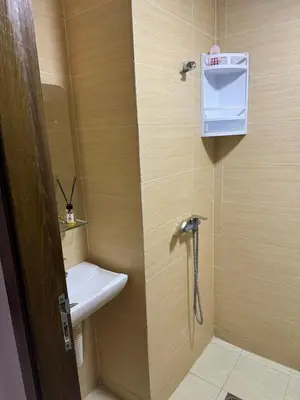 a small bathroom with a sink and a toilet at Maison avec ascenseur in Fès