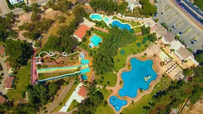 an overhead view of a park with a lake at Beautiful apartment near airport in Fès