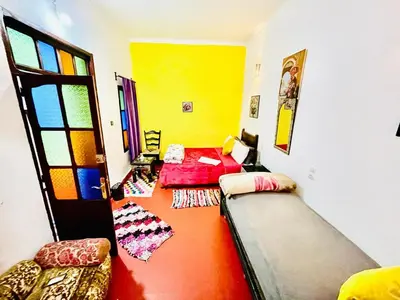 a room with a couch and a bed in it at Dar Bladi -A Quiet Place to Reset in Fes in Fès