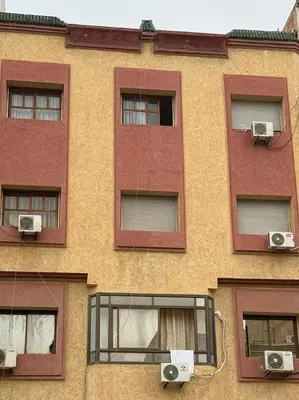 a building with three windows and two speakers at Residence Kawtar Meknès Marjane 2 in Meknès