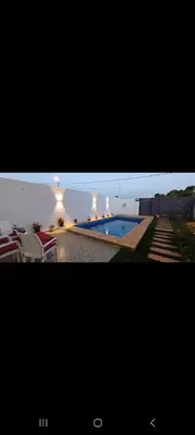 a picture of a swimming pool in a house at Villa de luxe in Imouzzer Kandar