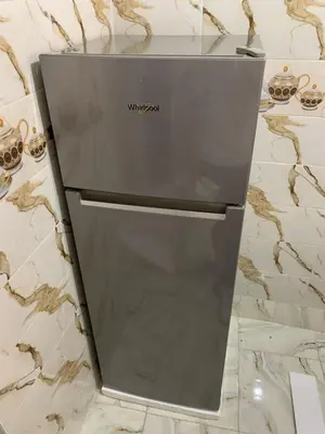 a grey refrigerator sitting on top of a counter at Appartement bel kayed in Fès