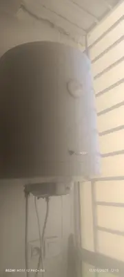 a white light hanging from a ceiling in a room at apartment raha in Oulad Akkou