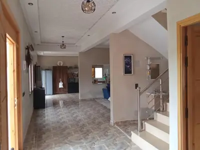 a hallway with a staircase in a house at Villa tagmouti in Aghmat