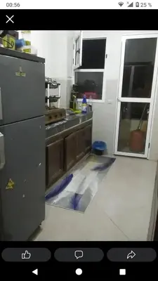 a kitchen with a kitchen floor with a counter top at Ikamat nakhil in Oulad Akkou