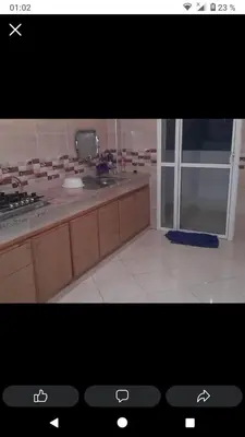 a picture of a kitchen with a counter top at Ikamat nakhil in Oulad Akkou