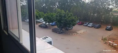 a view of a parking lot with cars parked at Appartement meublée in Oulad Akkou