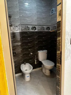 a small bathroom with a toilet and a bidet at Hay nahda dakhla in Oulad Akkou