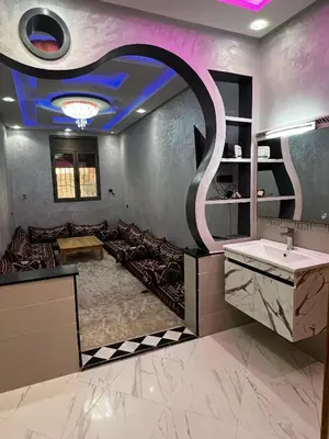 a bathroom with a sink and a mirror at Hay nahda dakhla in Oulad Akkou