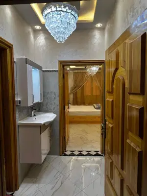 a bathroom with a sink and a bath tub at Hay nahda dakhla in Oulad Akkou