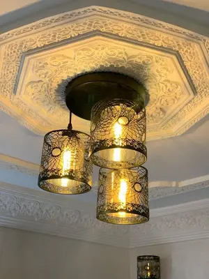 two chandeliers hanging from a ceiling at chez saad in Fès