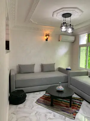 a living room with a couch and a table at chez saad in Fès