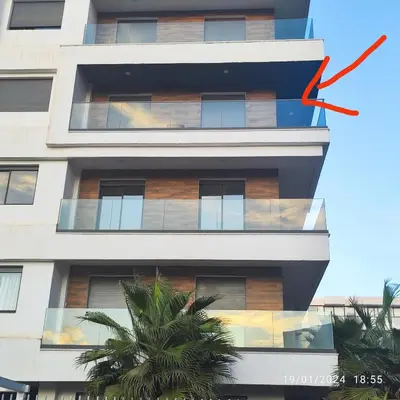 a building with a red arrow pointing up at Appartement luxe in Oulad Akkou