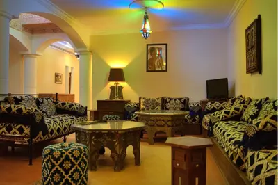 a living room with couches and a table at Villa Zazate private pool & starry garden in Ouarzazate