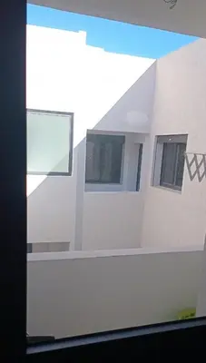 a view of a building with windows on the side at شقة مريحه in Oulad Akkou