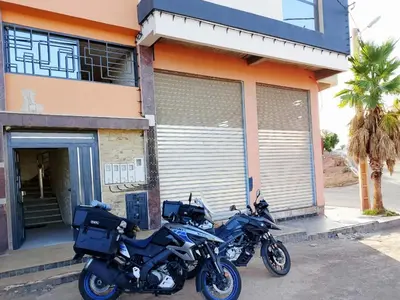 two motorcycles parked in front of a building at appartement luxueux khenifra 1 in Khenifra