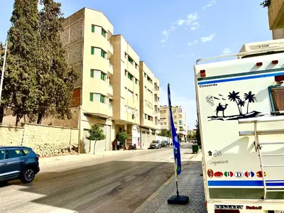 a truck parked on the side of a street at Diamond Fes Apartment in Fès