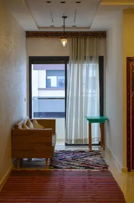 a living room with a couch and a window at Appartement Nadine Fès in Fès