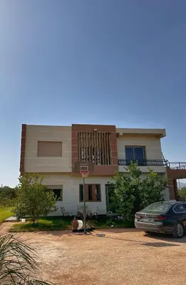 a house with a car parked in front of it at Villa Lina in Meknès