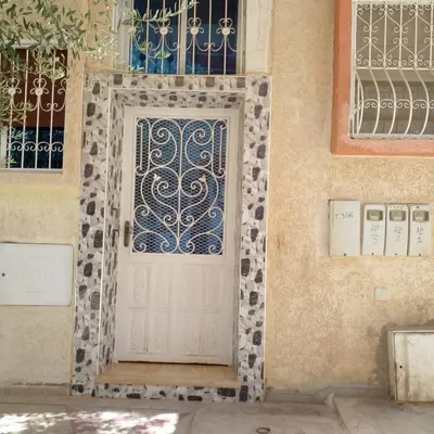 a door on a building with a tile at Vip charme in Fès