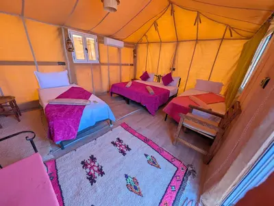 an overhead view of a tent with two beds and tables at Air Conditioning Berber Desert Camp in Merzouga