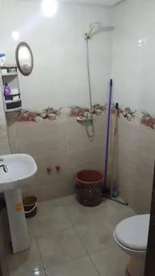 a bathroom with a shower and a toilet and a sink at Reda Ghazalie in Meknès