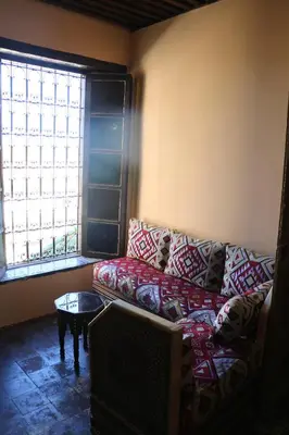 a living room with a couch and a window at The hostel with terrace view in Fès