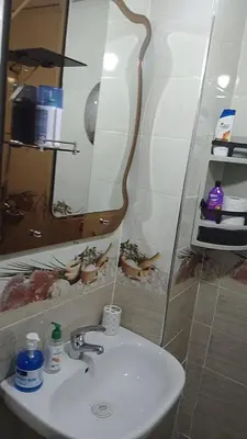 a bathroom with a sink and a mirror at 2 bedroom apartment for rent in Meknès