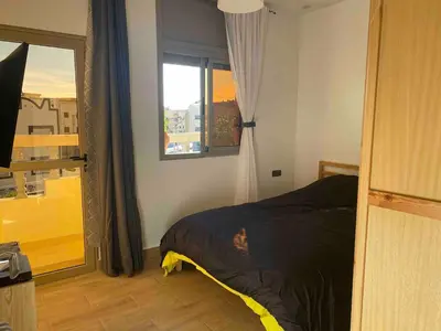 a bedroom with a bed and a window at Apartment Private room in apartment in Khouribga in Khouribga