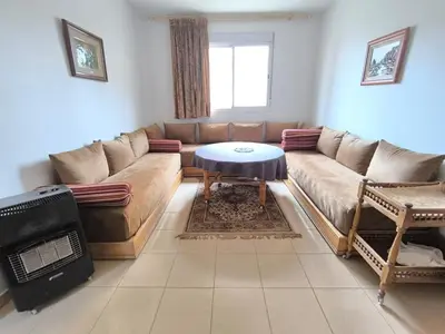 a living room with a couch and a table at Le séjour agréable in Ifrane