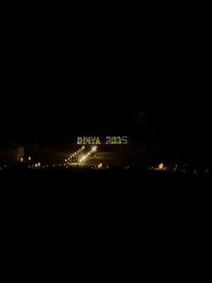 a plane is sitting on the runway at night at Morocco Desert Camp in Merzouga