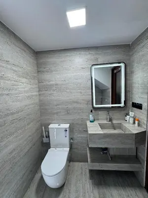 a bathroom with a toilet and a sink at Meknes Relax Home in Meknès