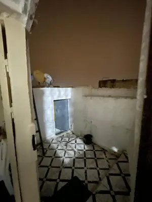 a room with a tile floor and a door at House medina in Fès